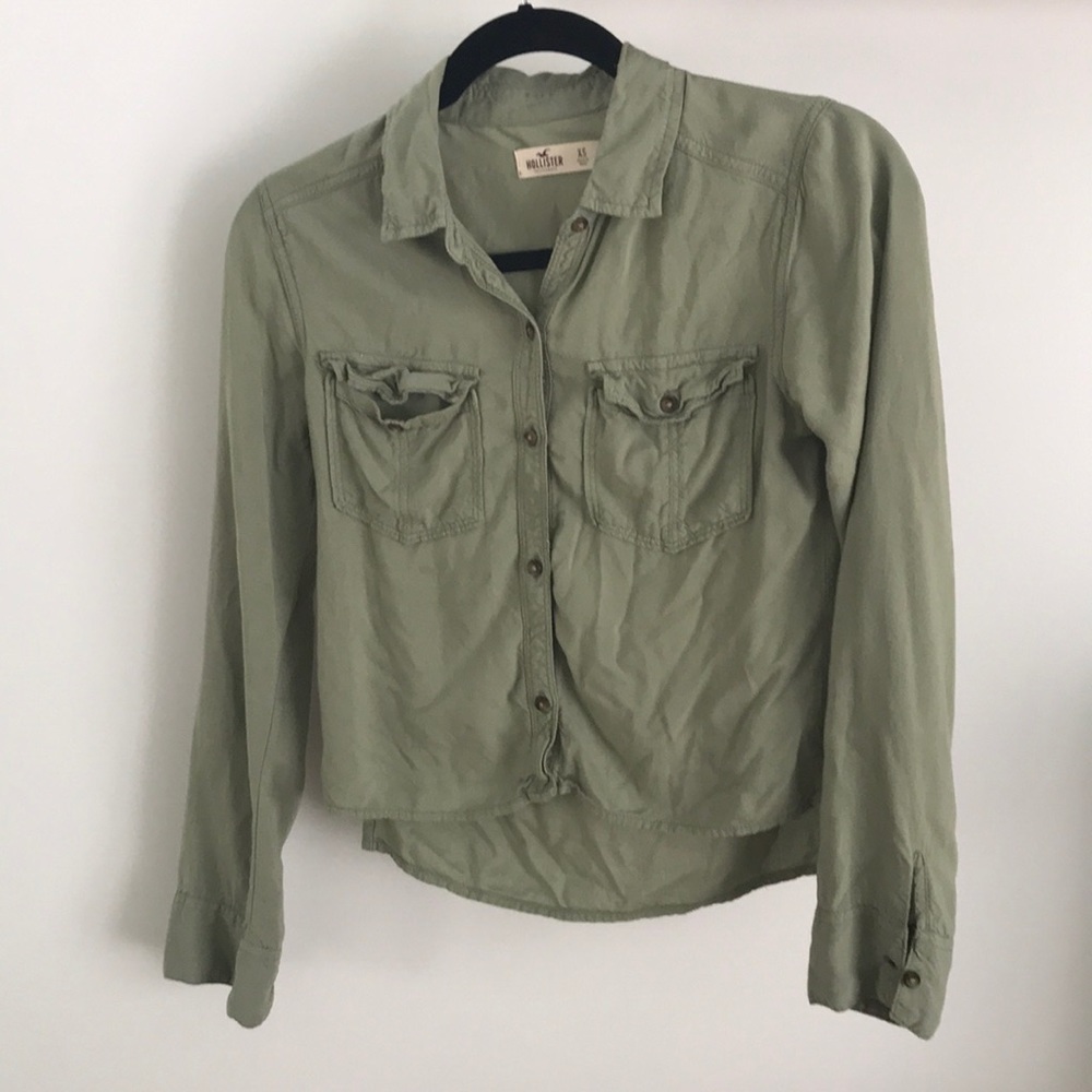 A navy green button down long sleeve shirt